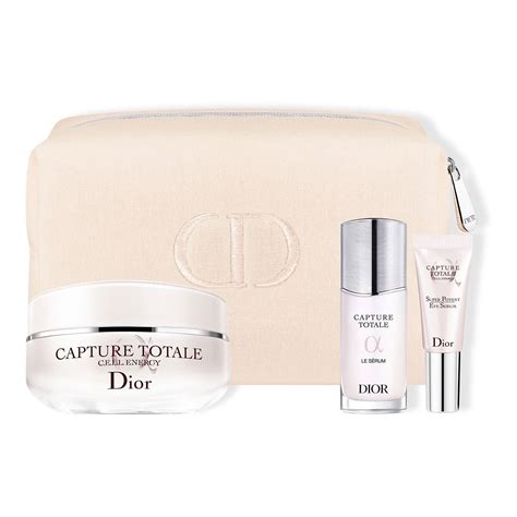 Three Capture Totale Skincare Products in a Dior Pouch .